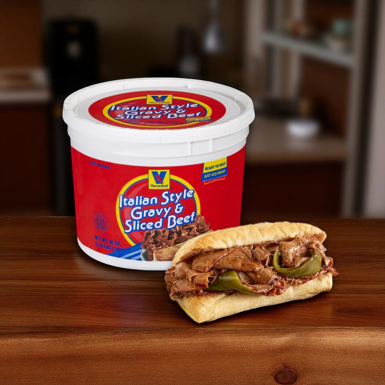A Chicago's Best – Iconic Eats from the Windy City Classic Chicago Sandwich Kit featuring Vienna Beef® Italian Style Gravy & Sliced Beef Frozen Meal and Turano French Rolls rests beside an Italian beef sandwich with green peppers.