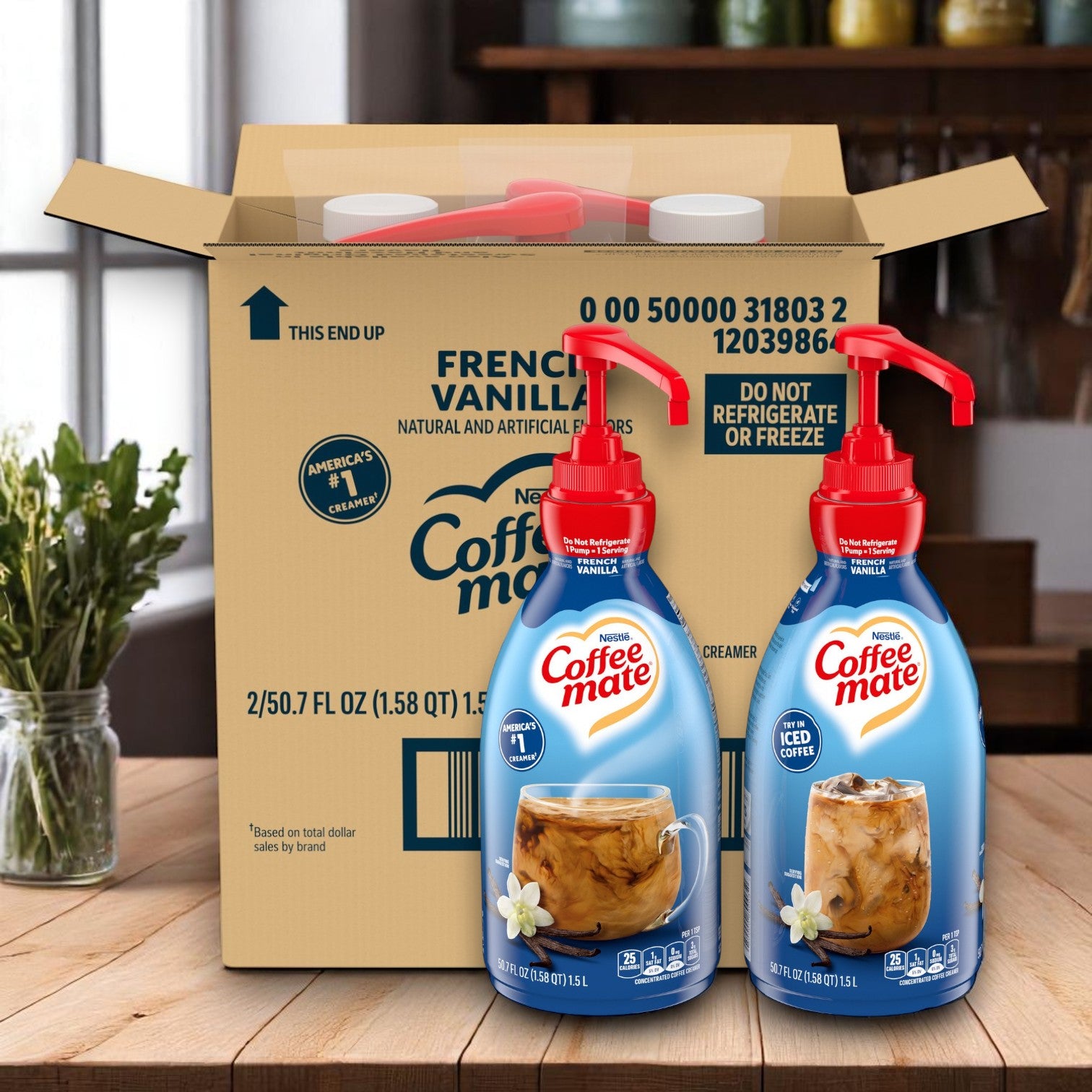 Two Easy Lunches Coffee Mate French Vanilla Liquid Creamer pump bottles (1.5L each) sit in front of an open shipping box on a wooden table, ready to add non-dairy flavor to your coffee.