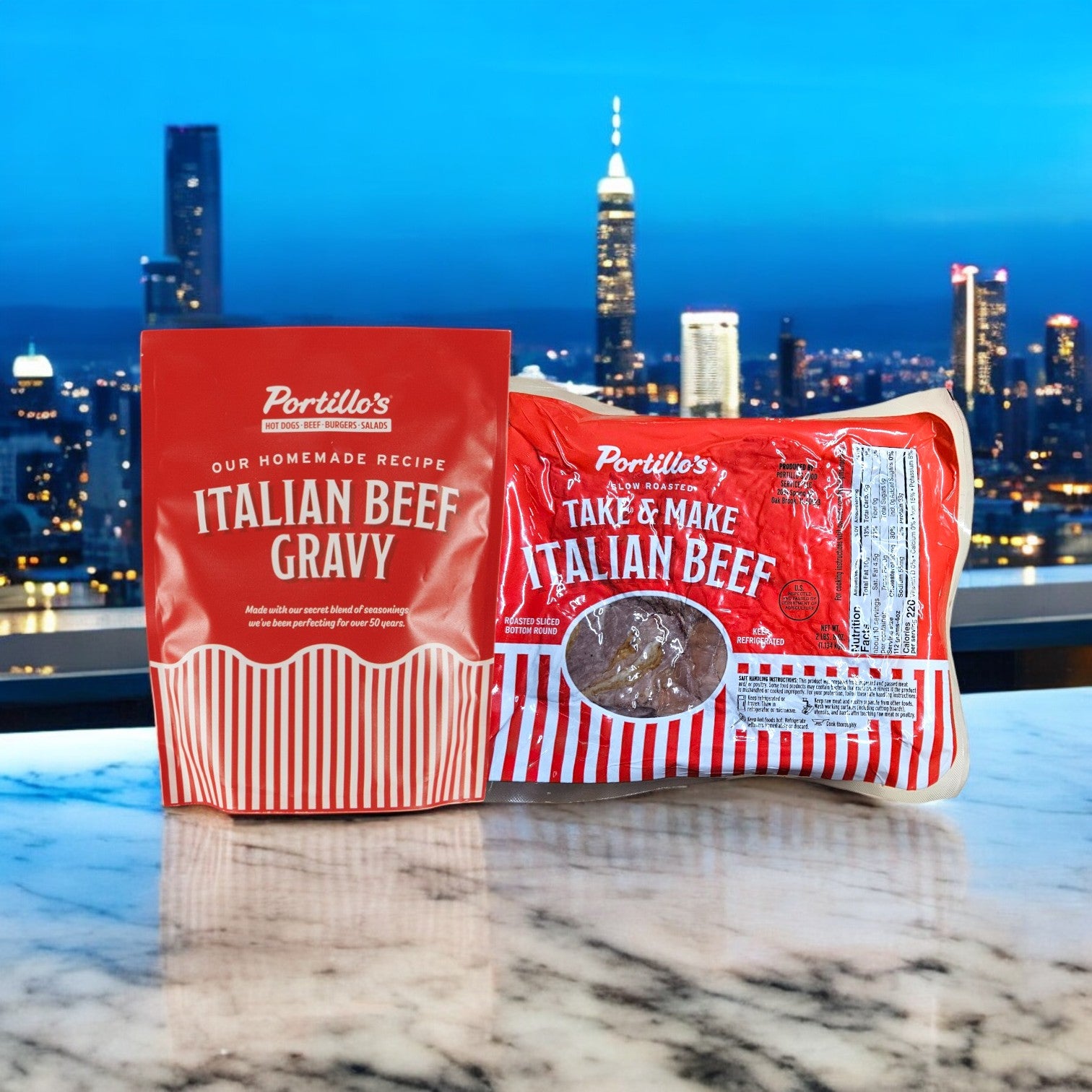 A package of Portillo's Italian Beef Gravy and 2 lbs. Take & Make Italian Beef! rest on a marble surface, set against a city skyline, capturing the essence of authentic Chicago-style sandwiches.