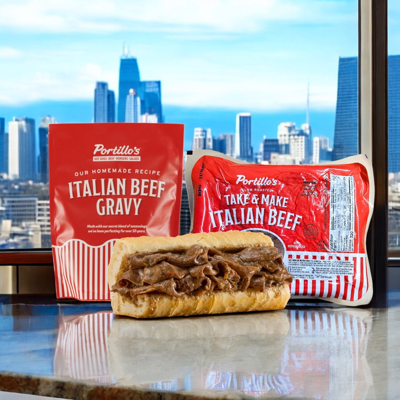 An enticing dish of Portillo's Italian Beef Gravy and 2 lbs. Take & Make Italian Beef rests on the table, framed by the city skyline, capturing a quintessential Chicago-style delight.