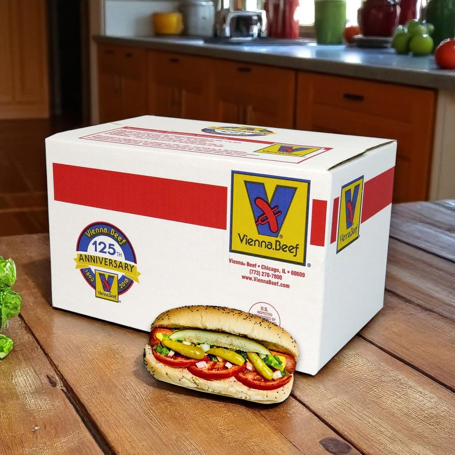 A box of Vienna Beef- Polish Skinless Smoked Beef Links sits on a wooden counter with a Chicago-style hot dog in front, showcasing the 6-inch, 5:1 beef links (10 lbs., 50 total) and capturing classic Chicago flavor.
