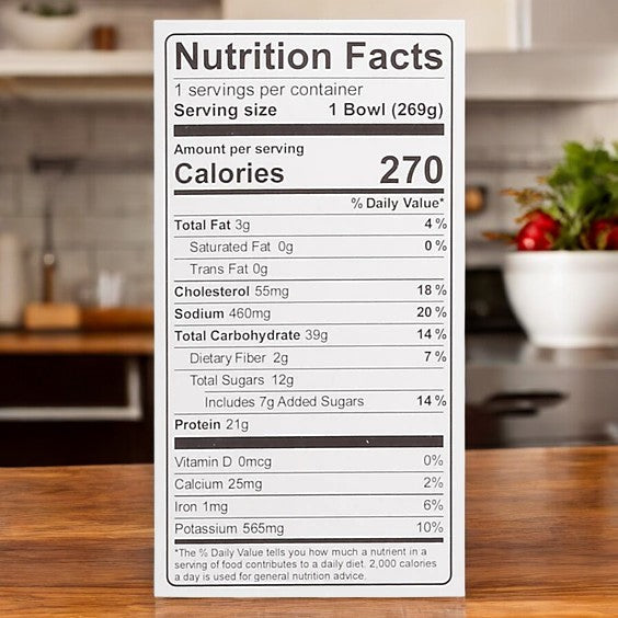 Kevin's Natural Foods Orange Chicken (1 Count) nutrition label shows 270 calories per serving, with info on fat, cholesterol, sodium, carbs, protein, vitamins, minerals—and a bowl featured in the background.