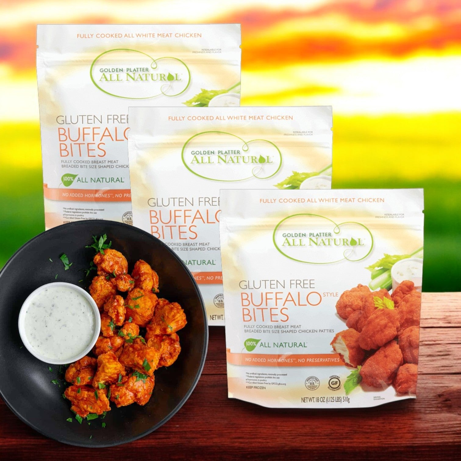 Three packs of Golden Platter All Natural Gluten Free Buffalo Style Bites (24 count each) are shown behind a plate of cooked buffalo bites with ranch dipping sauce.