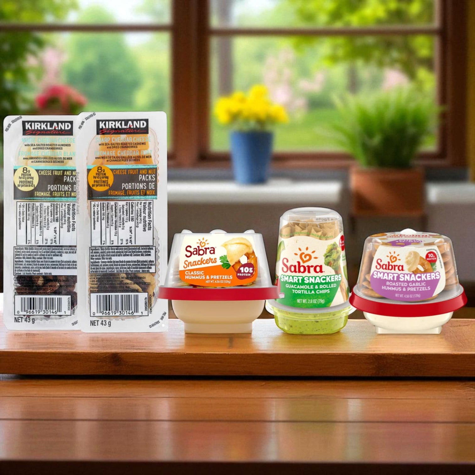 Snack Box - 12 Sabra Roasted Garlic Hummus, 12 Sabra Classic Hummus, 12 Sabra Guacamole & Tostitos, 16 Kirkland Cheese Fruit Nut Packs