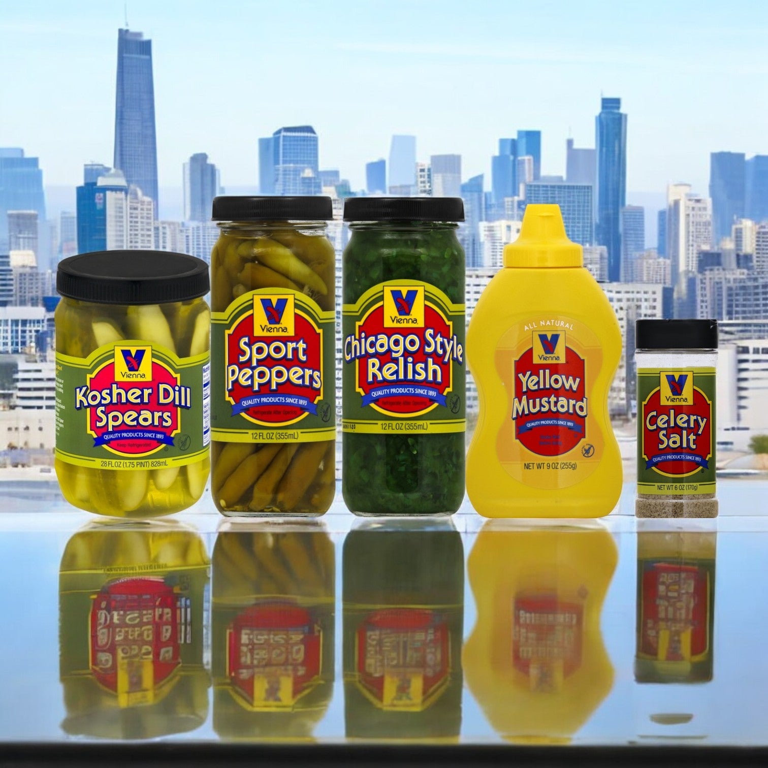 Introducing the Vienna Hot Dog Kit! Chicago Style! featuring 20 hot dogs with buns and a selection of classic condiments, including Kosher Dill Spears, Sport Peppers, Chicago Style Relish, Yellow Mustard, and Celery Salt. Brought to you by Vienna Beef and displayed against the iconic Chicago city skyline backdrop.