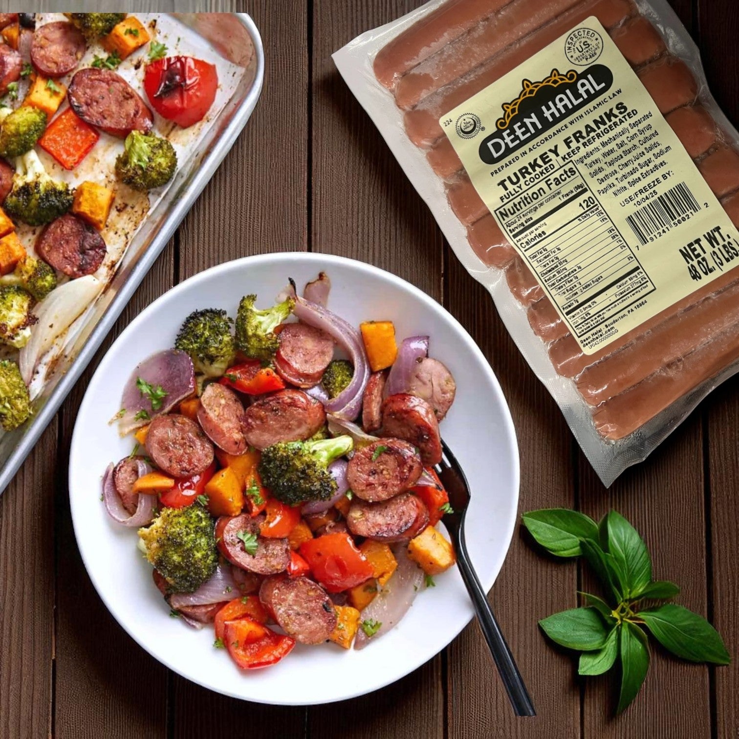 A bowl of roasted vegetables and sliced Deen Halal Turkey Franks – 48 oz, 24 Count Pack sits beside a tray of the same dish and the Deen Halal package, all garnished with fresh basil leaves on a wooden surface.