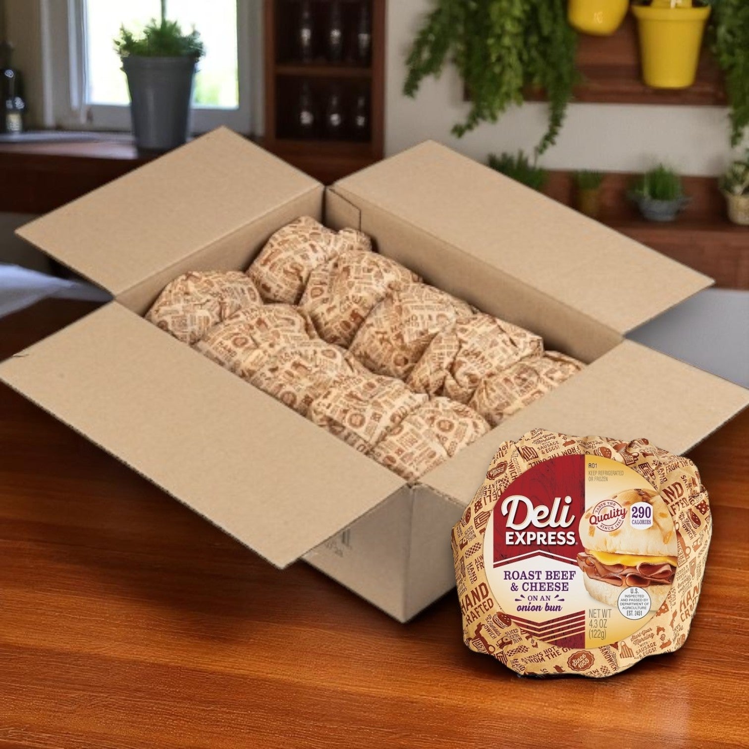 An open case of E.A. Sween Deli Express Roast Beef & Cheese Sandwiches (4.3 oz, 10-count) sits on a wooden table, with one individually wrapped sandwich displayed in front of the box.