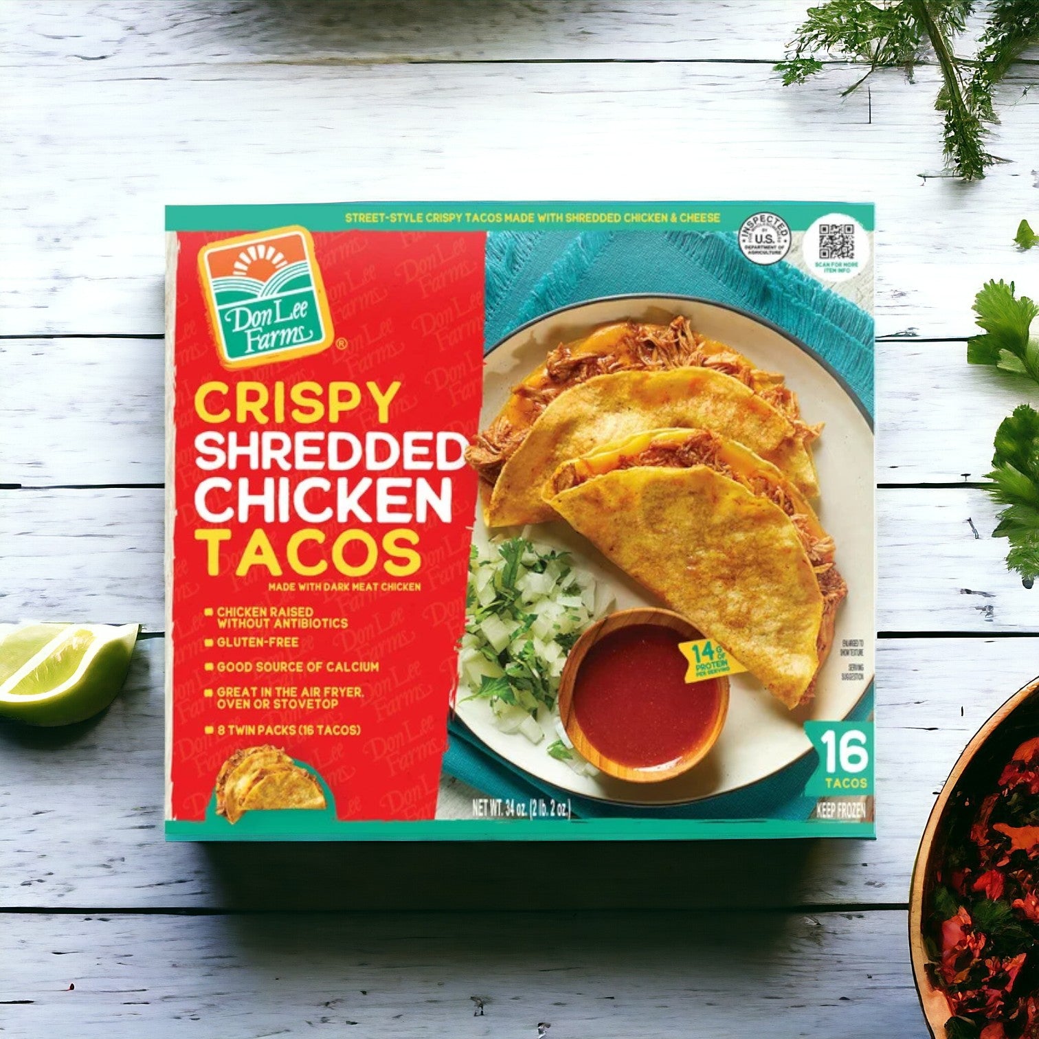 The image showcases an Easy Lunches box from the Ultimate Gluten Free Variety Pack, featuring crispy shredded chicken tacos (16 count) with a taco serving suggestion accompanied by a lime wedge and cilantro on a white wooden surface.