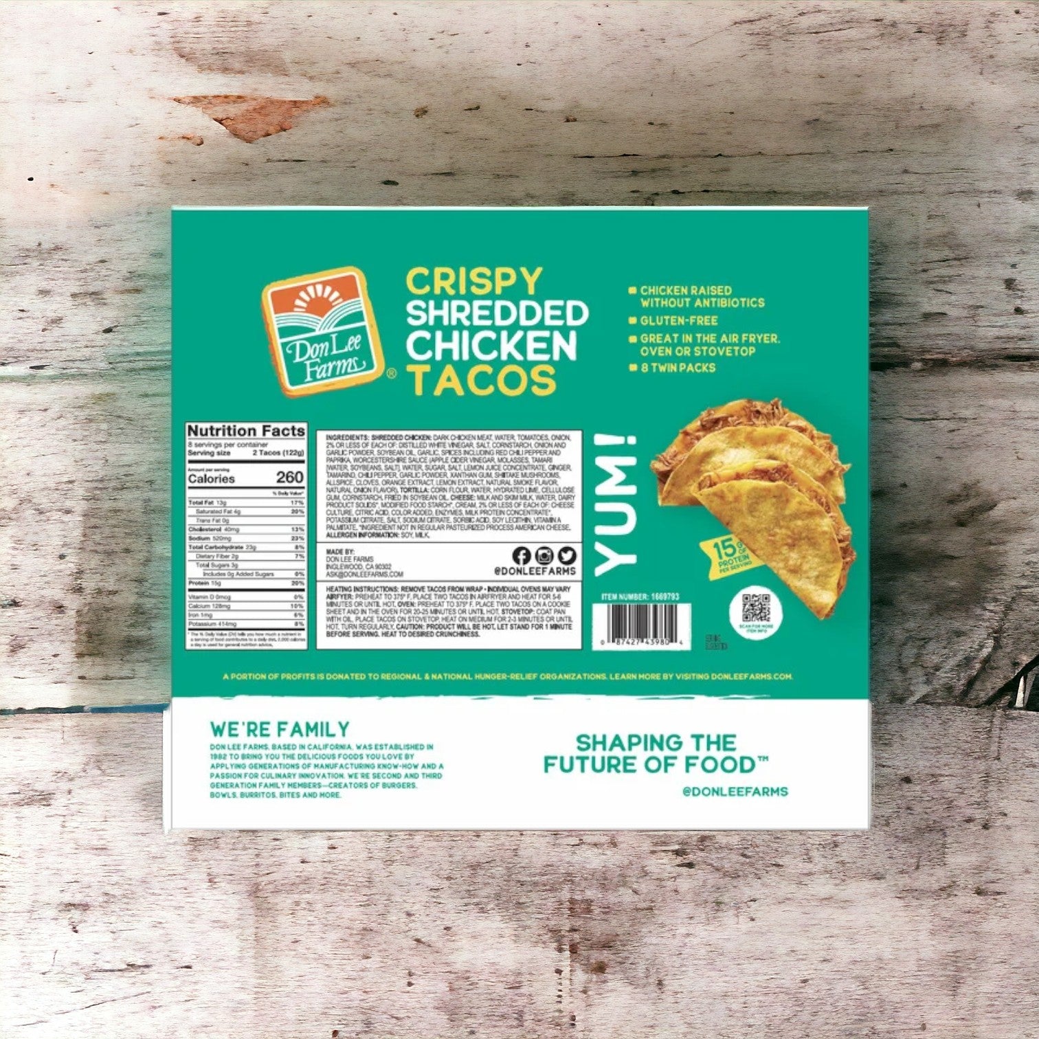 Box of Easy Lunches Don Lee Crispy Shredded Chicken Tacos, 16-count, 1 Pack on wooden surface, displaying nutrition facts and cooking instructions. Crafted with high-quality ingredients, these tacos offer a convenient heat-and-eat meal option.