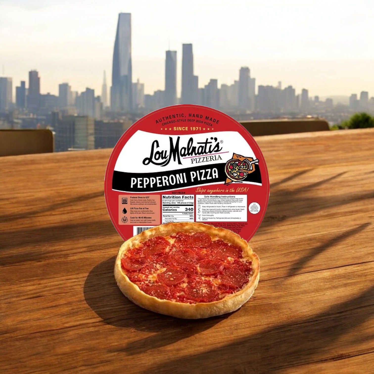 A Chicago’s Best Combo Kit – Lou Malnati’s Deep Dish & Vienna Italian Beef from Easy Lunches sits in front of its packaging on a wooden table outdoors, with a city skyline and tall buildings in the background.