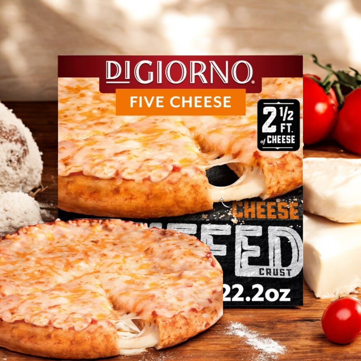 DiGiorno Five Cheese Frozen Pizza with Cheese Stuffed Crust – 22.2 oz by DiGiorno is shown in its packaging, with the pizza in front, surrounded by flour, cheese, and tomatoes on a wooden surface.