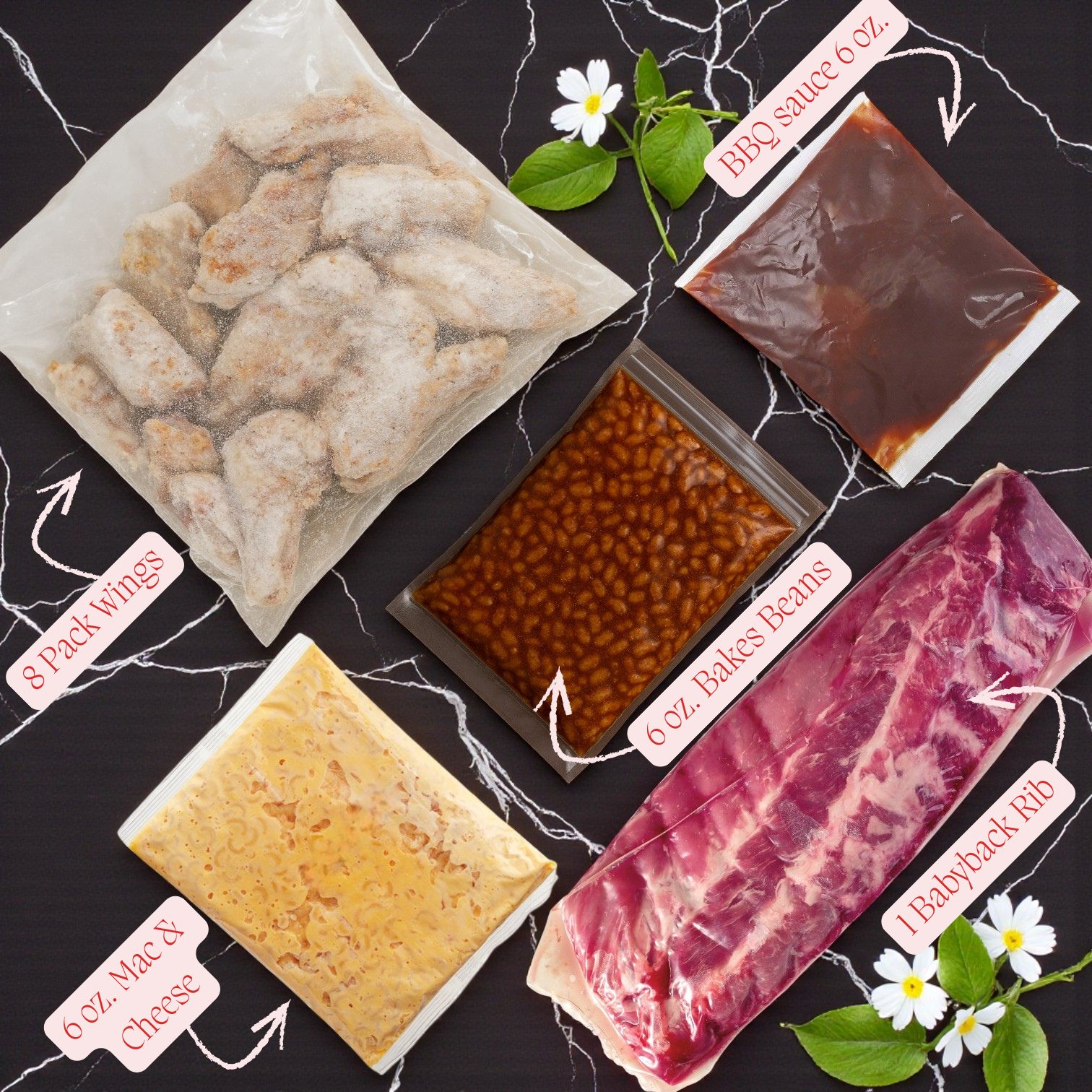 A flat lay of the TJ Ribs - Full Single Dinner by TJ Ribs: includes wings, BBQ sauce, baked beans, mac & cheese, and baby back rib, served on a black surface with white flowers for the perfect dinner.