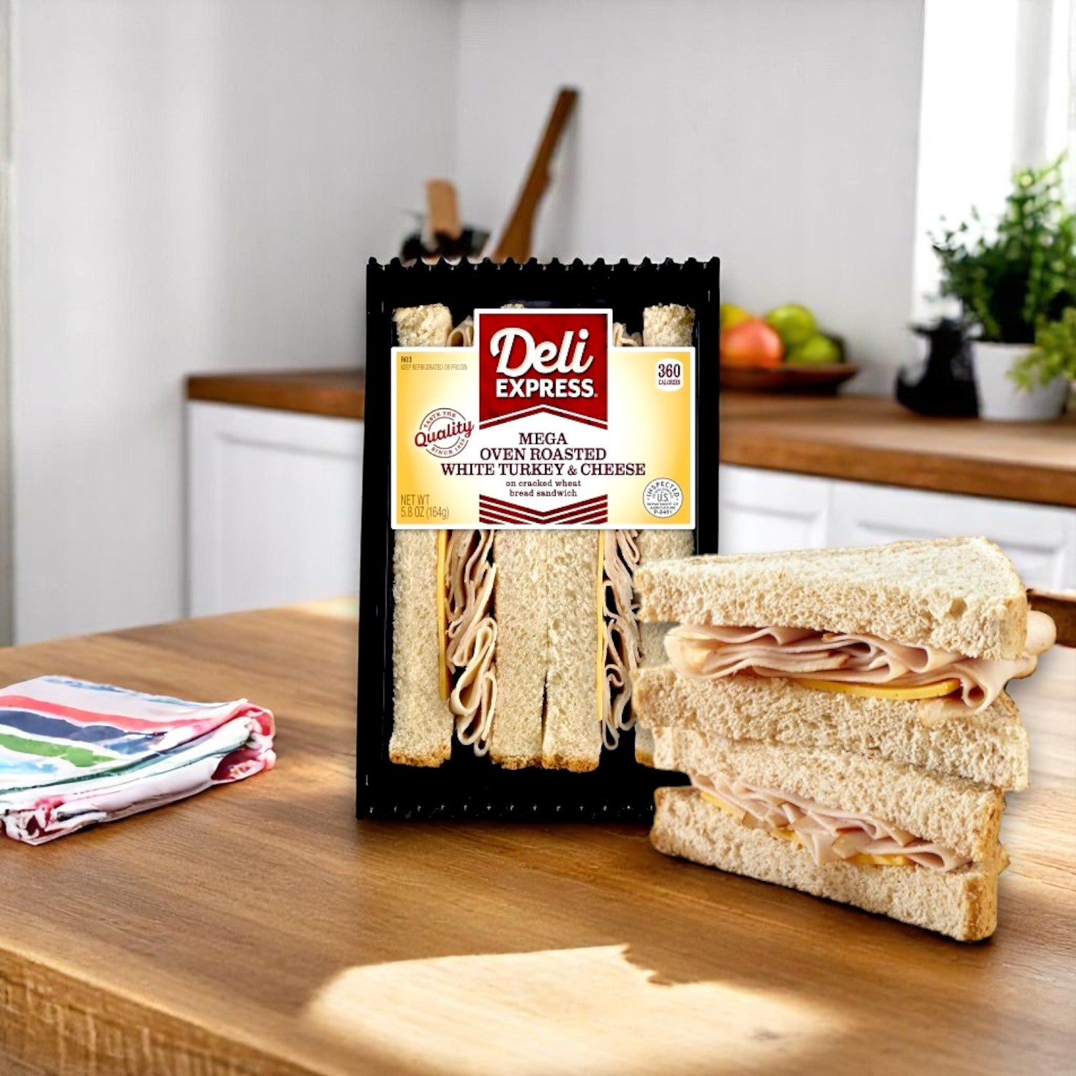 E.A. Sween Deli Express Mega Hickory Smoked Turkey & Cheese Sandwich Wedge (5.8 oz, individually wrapped) is displayed on a kitchen counter, with one sandwich cut in half and stacked nearby.