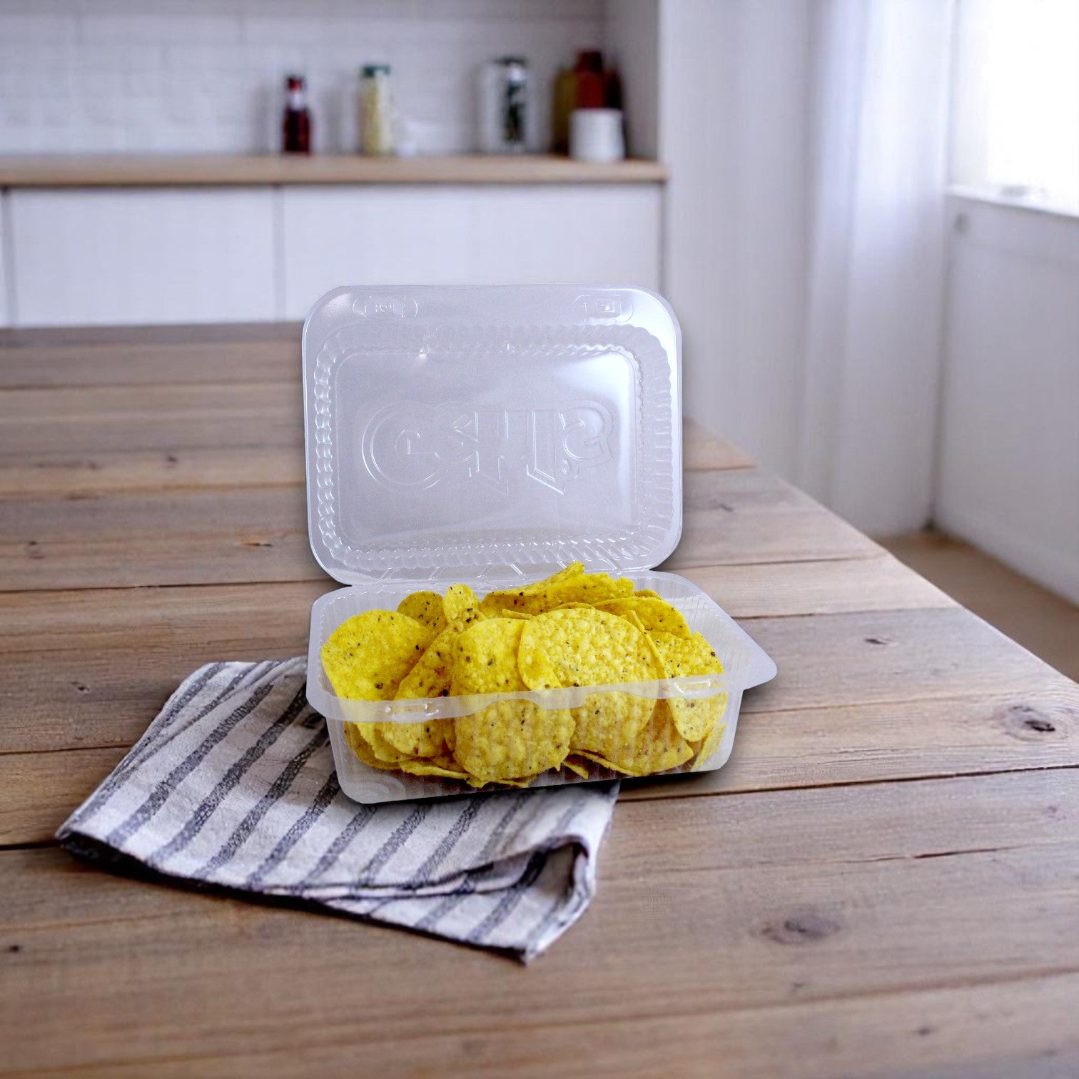 A 3 oz container of Gehl’s Tortilla Chips with Cheese Tray sits on a wooden table—perfect for a quick snack. Comes in a 30-count pack from Gehl's.