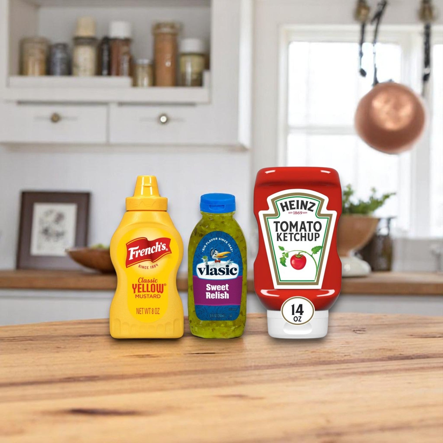 French’s yellow mustard, Vlasic sweet relish, and Heinz tomato ketchup sit on a wooden counter, ready to top your Nathan's Famous Hot Dog Kit – Ultimate Backyard BBQ Bundle (25-Pack Combo) for the perfect meal.