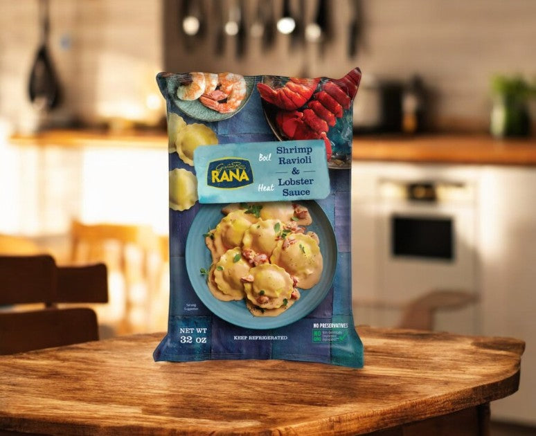 A pack of Giovanni Rana Shrimp Ravioli With Lobster Sauce, 16 oz, 2-count, rests on a kitchen table—ready to enjoy as a tasty seafood meal.