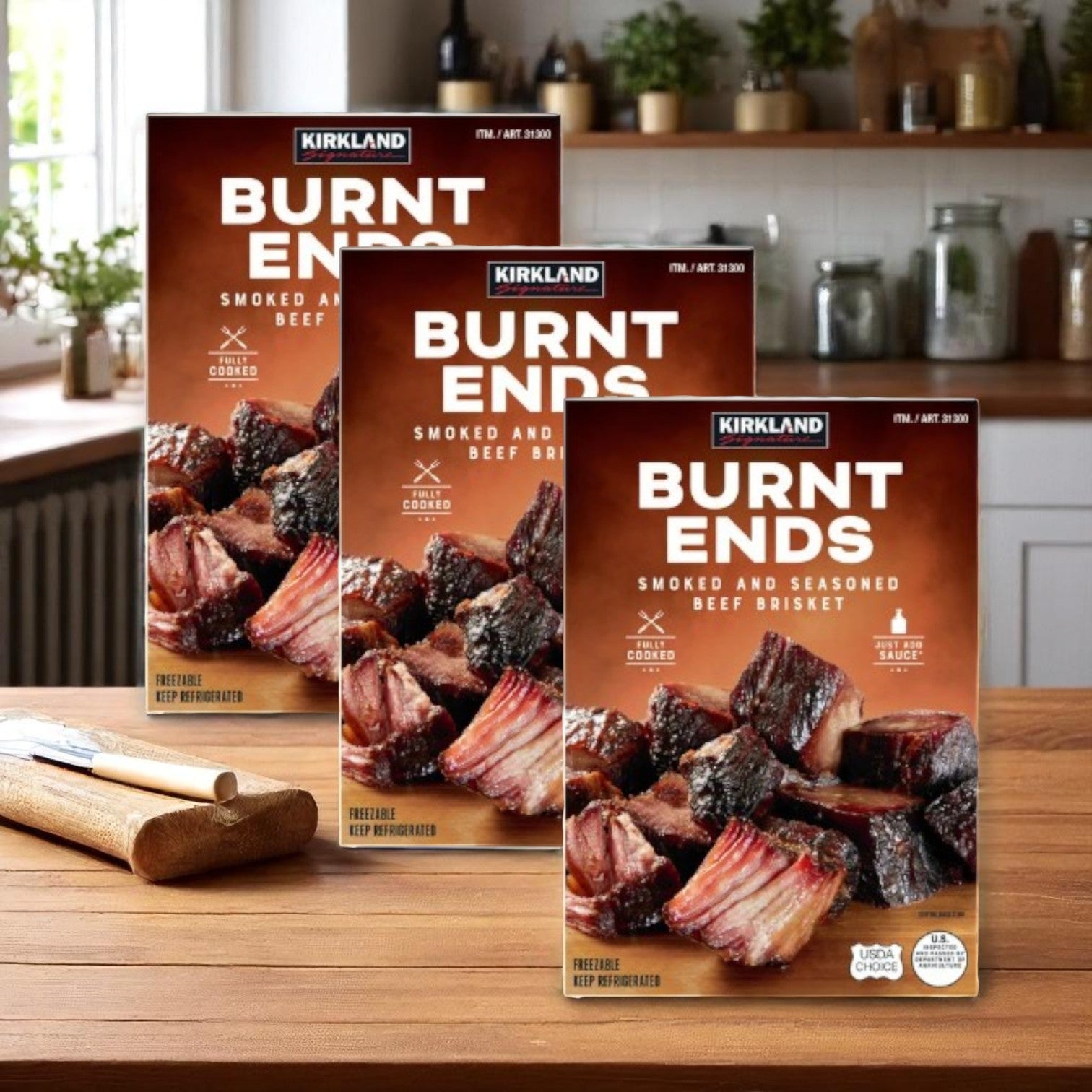Three cases of Kirkland Signature Brisket Burnt Ends (1.67 lbs each) are displayed on a wooden counter, highlighting the smoked and seasoned beef brisket from Kirkland Signature.