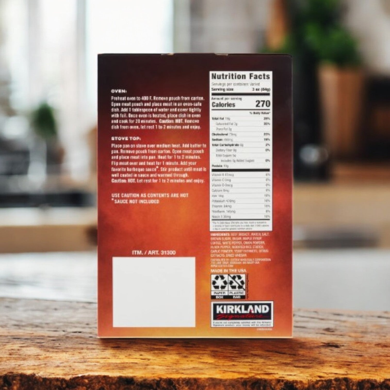A box of Kirkland Signature Brisket Burnt Ends-1.67 lbs-1 Case from Kirkland Signature rests on a wooden table, displaying the back with nutrition facts, instructions, and recycling symbols visible.