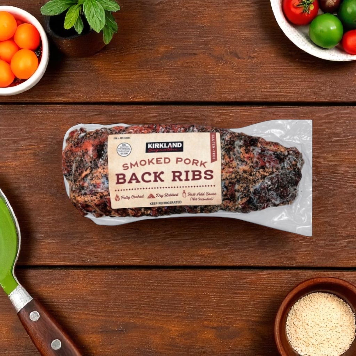 A vacuum-sealed pack of Easy Lunches Kirkland Signature Smoked Pork Ribs rests on a wooden table with bowls of veggies, spices, and a green spatula—ideal for making delicious smoked ribs with your favorite BBQ glaze.