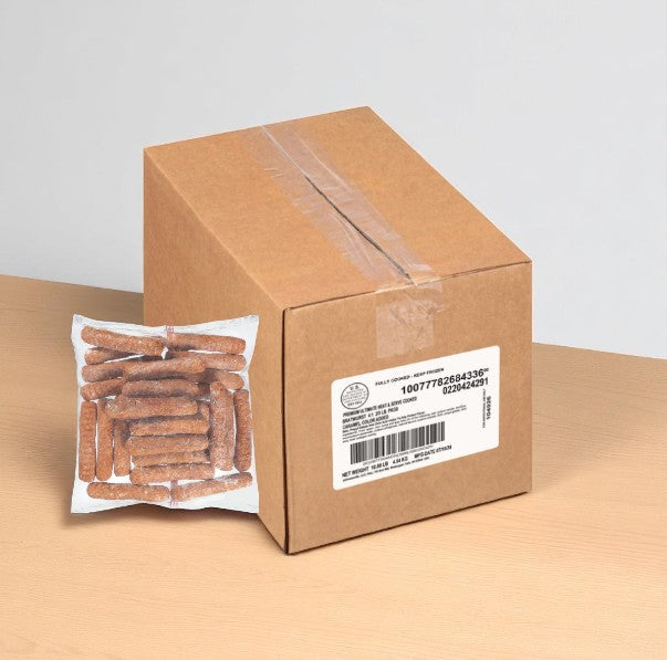A sealed cardboard box with a shipping label sits on a table next to a clear package of Johnsonville Ultimate Brat 4:1 Ultimate, fully cooked gluten-free pork sausage links (2 packs, 5 lbs each, 1 case).