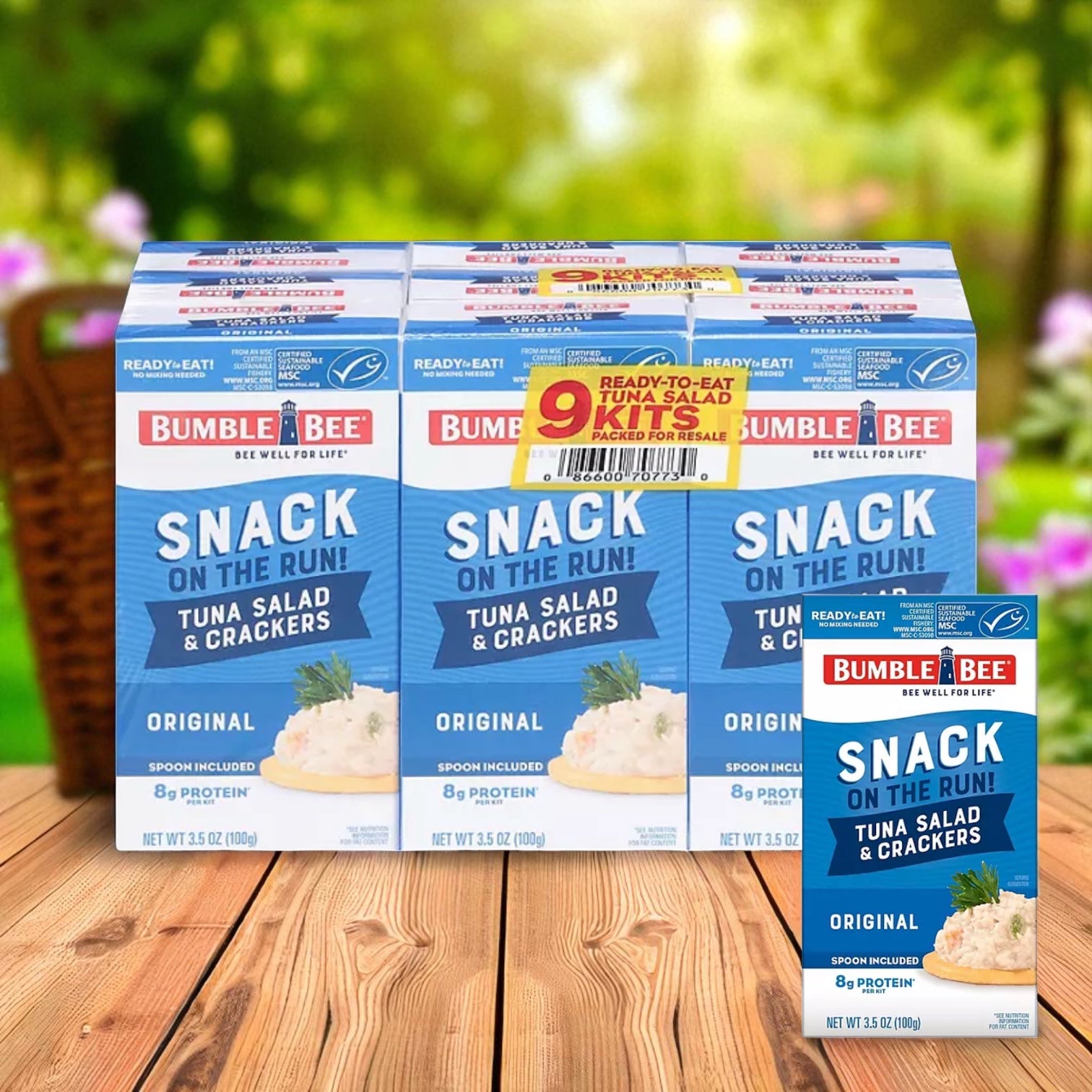 A 9-pack of Bumble Bee Tuna Salad Snack On The Run Kits (3.5 oz each) is displayed on a wooden table with a blurred outdoor background.
