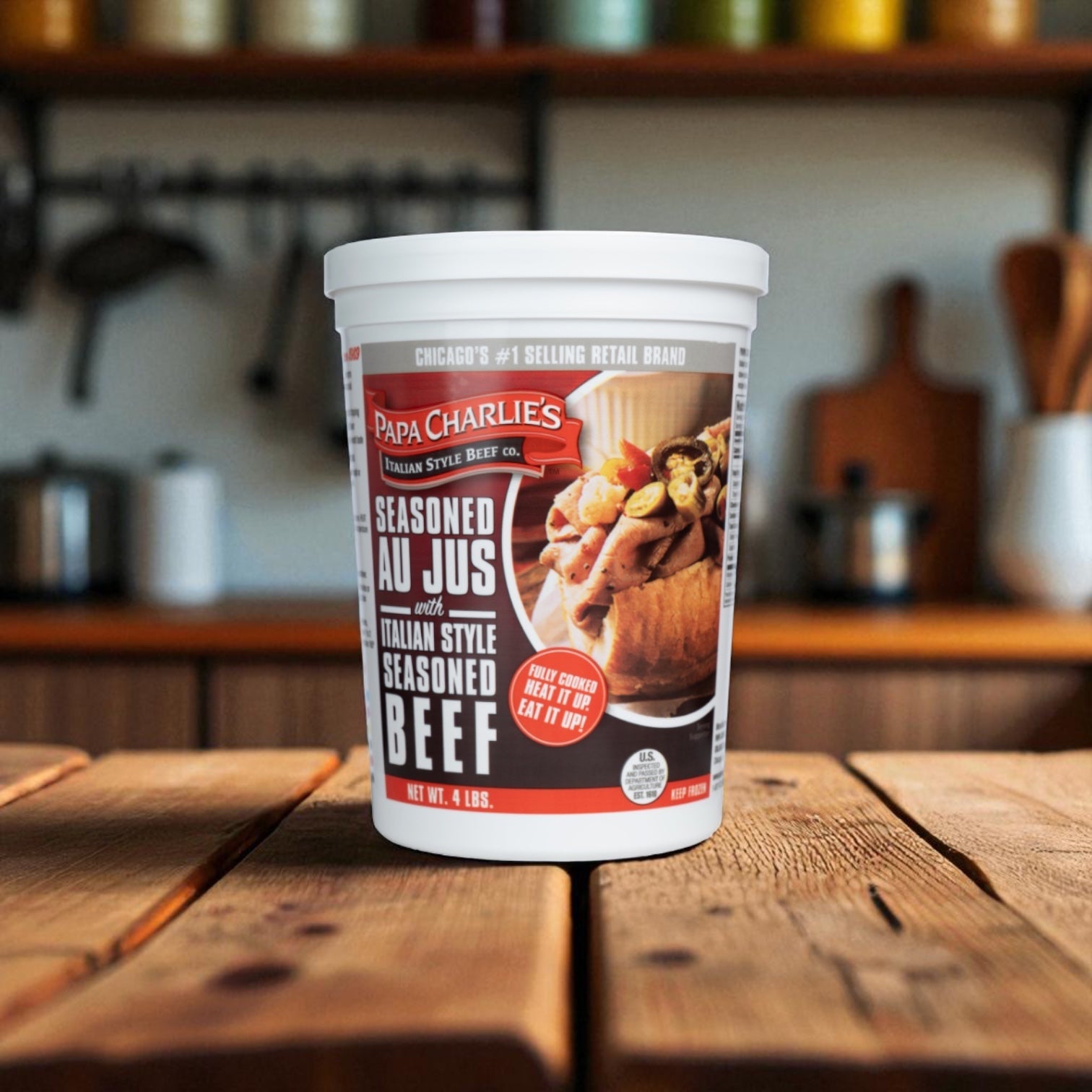 A Papa Charlie's Gonella Bread Mild Giardiniera Italian Beef Sandwich Kit - 3 Count sits on a wooden table, ready to be enjoyed as the perfect Chicago-style Italian beef sandwich meal.