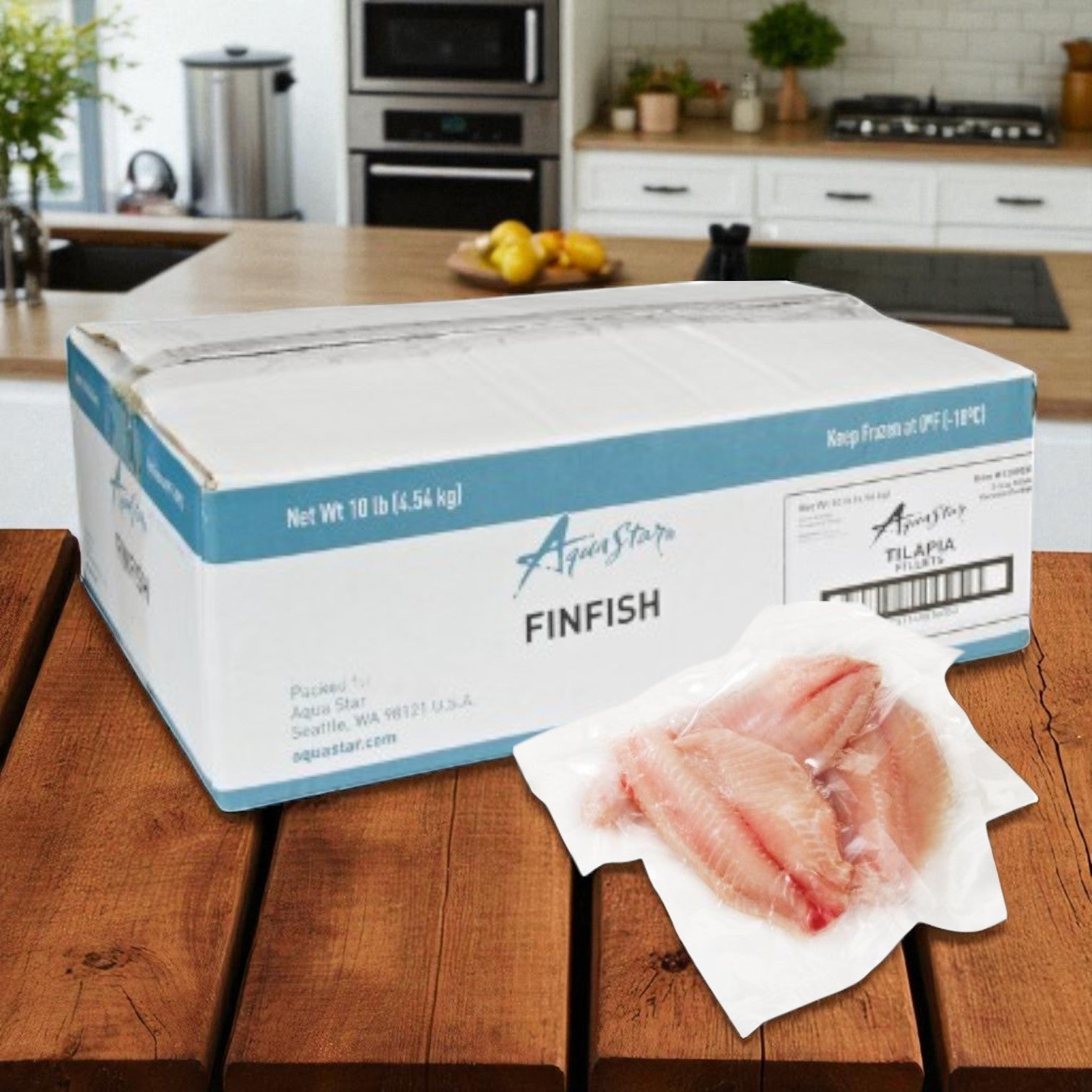 A 10 lb case of Easy Lunches Aqua Star Farmed Tilapia Fillets (5-7 oz portions) sits on a kitchen counter, with vacuum-sealed tilapia fillets displayed in front and a kitchen visible in the background.