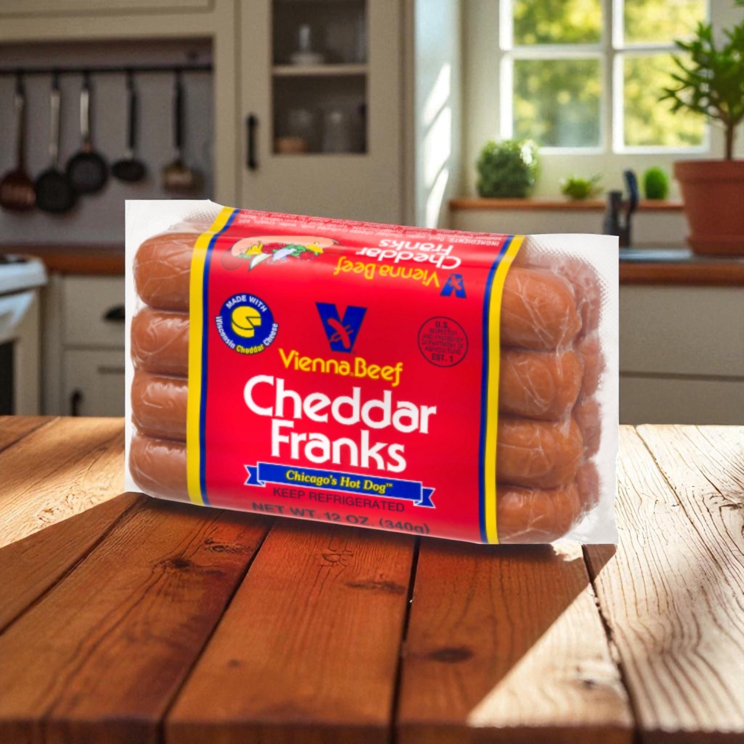 A pack of Vienna Beef Cheddar Franks 12 oz 12 pack - 12 Count sits on a wooden kitchen table in a sunlit kitchen, ready to be enjoyed with your favorite savory hickory-smoked sausage at your next meal.