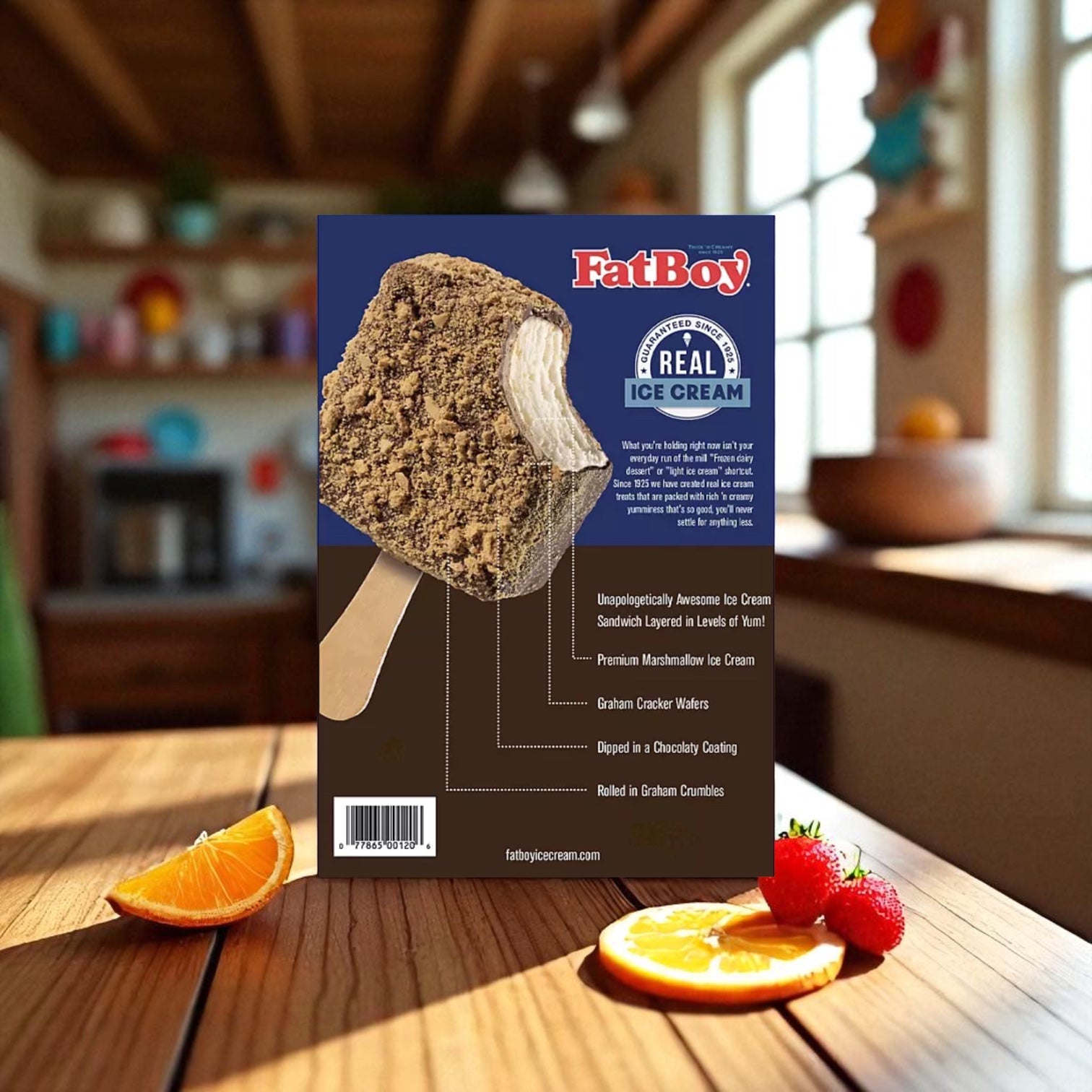 A FatBoy Smores Sandwich Bars, 12 Pack - 3 Count promotional sign sits on a wooden table, highlighting key ice cream features; fresh fruit slices and a bright kitchen appear in the background.