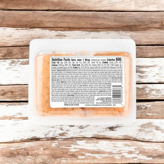 E.A. Sween Turkey Club With Bacon, Ham, Cheddar Cheese & Ranch Dressing Wrap comes in an 8-count case, ships frozen, and has a 30-day shelf life in the cooler once thawed. Nutrition facts label shown on plastic container atop rustic wood.