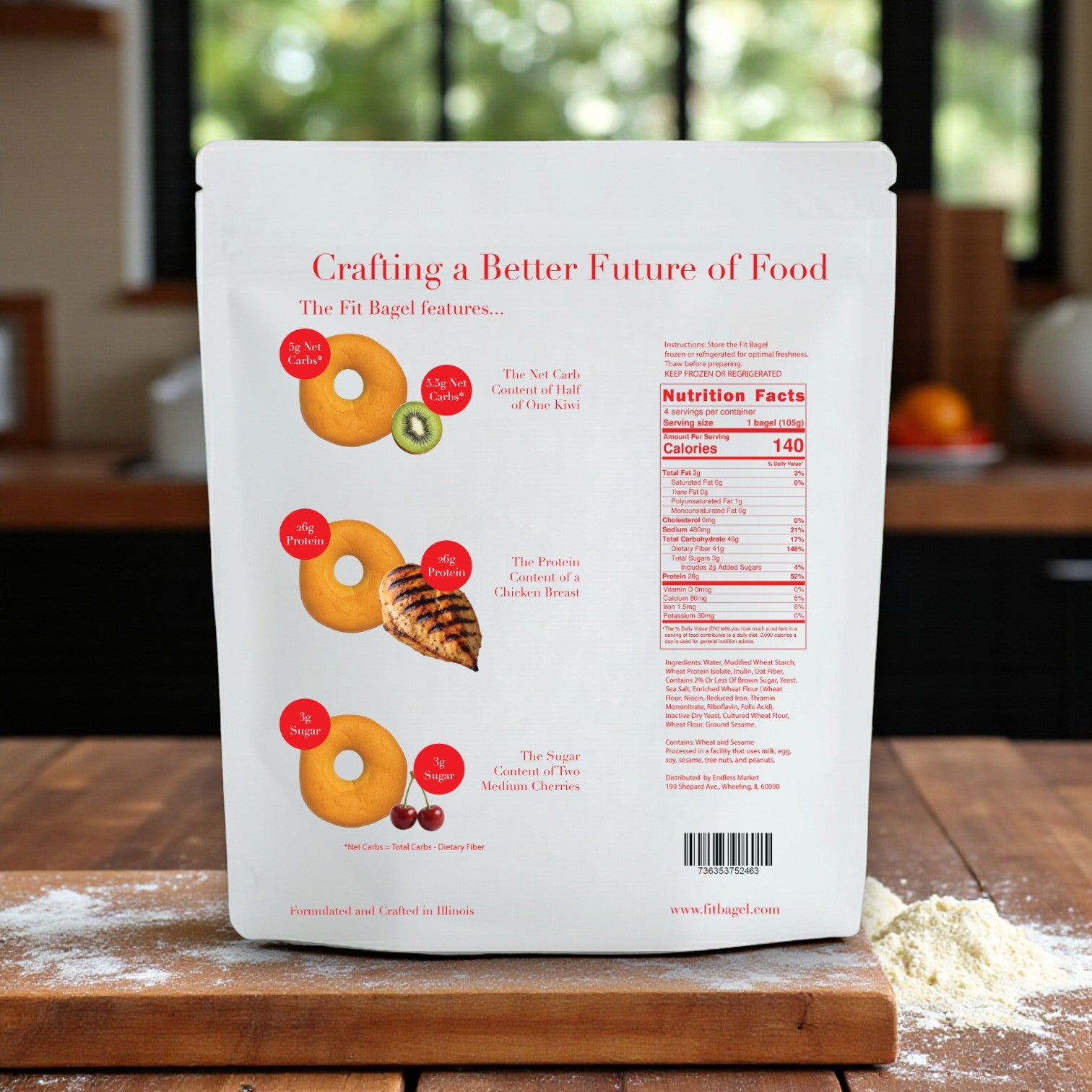 A kitchen counter displays The Fit Bagel's Better Brand Bagel & Fit Bagel Variety Pack—2 Classic, 2 Pretzel Buns, 2 Sesame, 2 Everything—8 bags (32 bagels), with nutrition facts and a low net carb comparison infographic. Flour is sprinkled nearby.