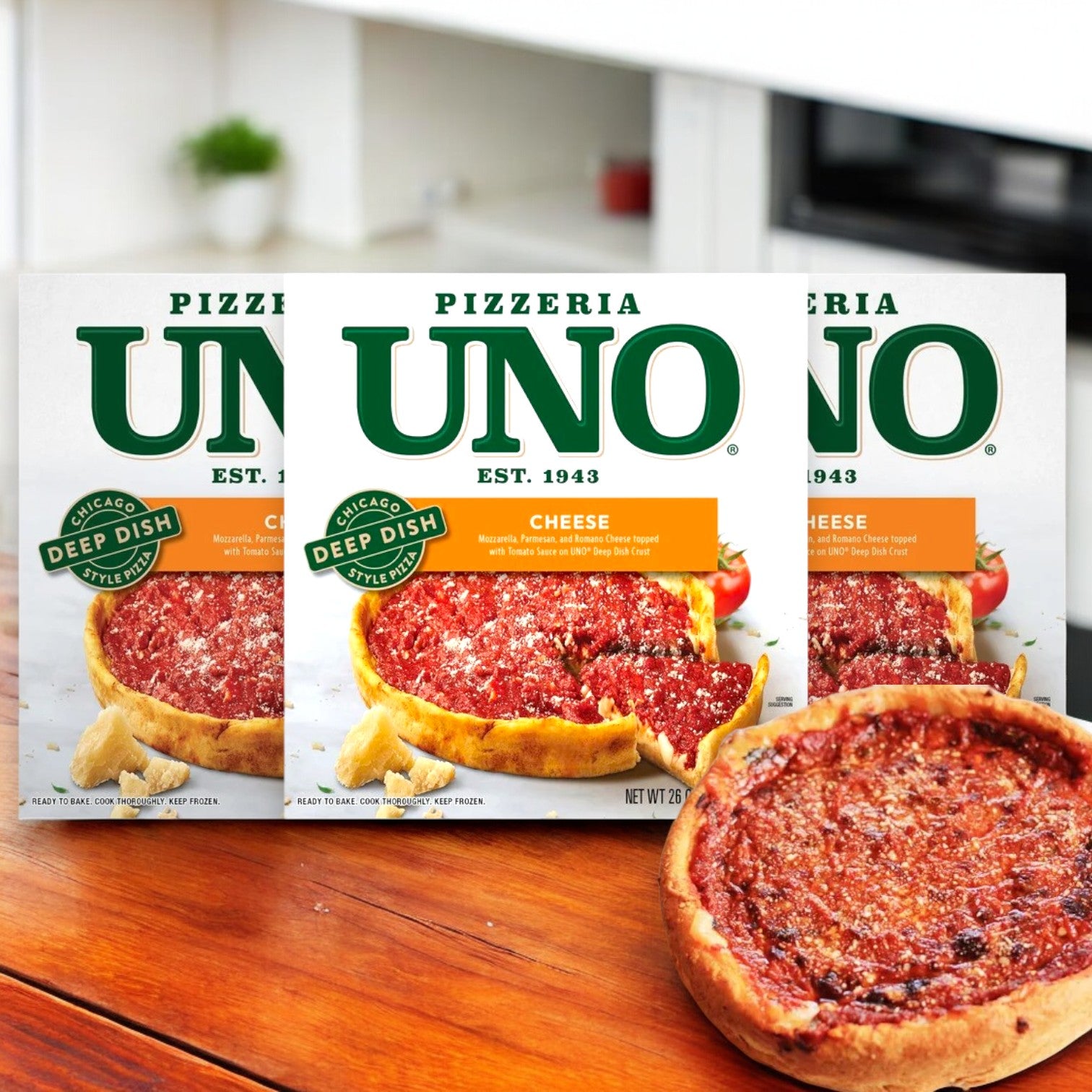 Three Uno Chicago Style Deep Dish Cheese Pizzas, 26 oz., are displayed, highlighting the buttery crust and rich mozzarella cheese, with one opened pizza in front.
