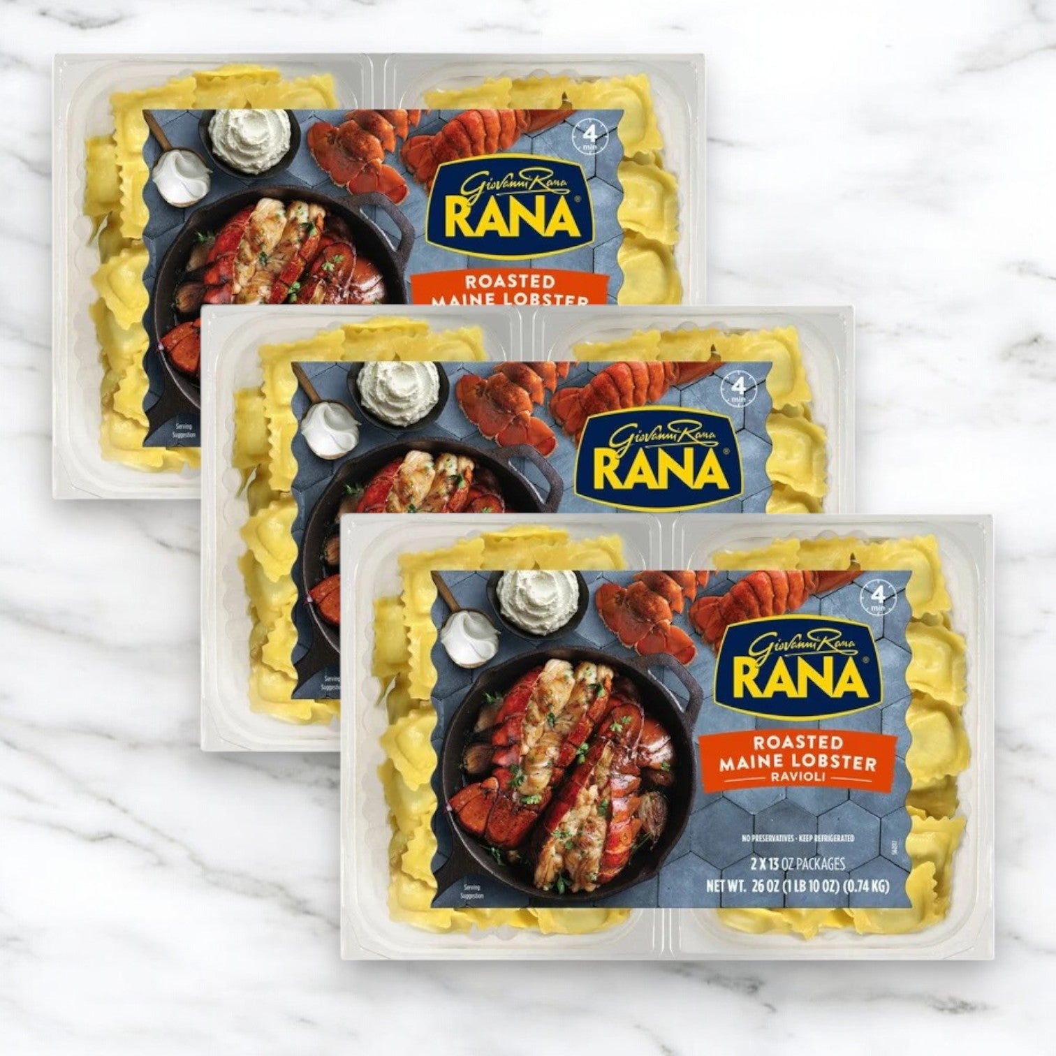 Three packages of Giovanni Rana Rana Maine Lobster Ravioli, 78 oz, are arranged overlapping on a white marble surface.