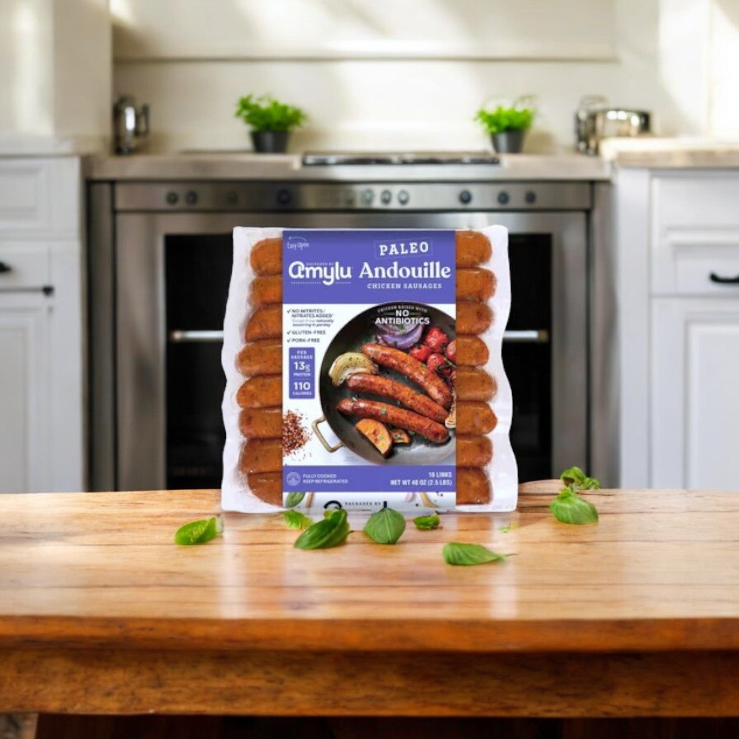 Amylu’s 4-Pack Combo – Premium Chicken & Sausage Variety, made with antibiotic-free chicken, sits on a wooden counter with the kitchen stove and potted herbs creating a welcoming backdrop.