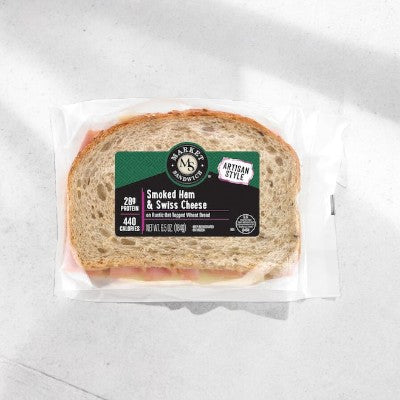 E.A. Sween Ham & Swiss sandwich features premium ham and Swiss cheese on rustic oat-topped wheat bread; ships frozen in 1 case of 8, with a 30-day cooler shelf life once removed from the freezer. Black label shows nutrition and product details.