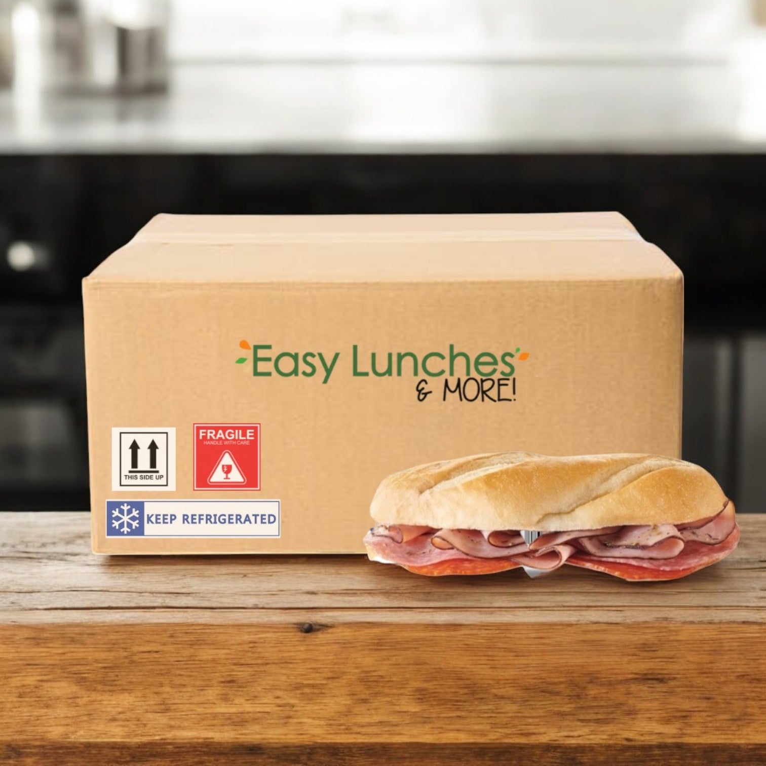 A cardboard box labeled "E.A. Sween Italian Style Sub – 1 Case, 8 Count – Ships Frozen, 30-Day Shelf Life in Cooler" sits on a counter next to a ham and provolone cheese sandwich.
