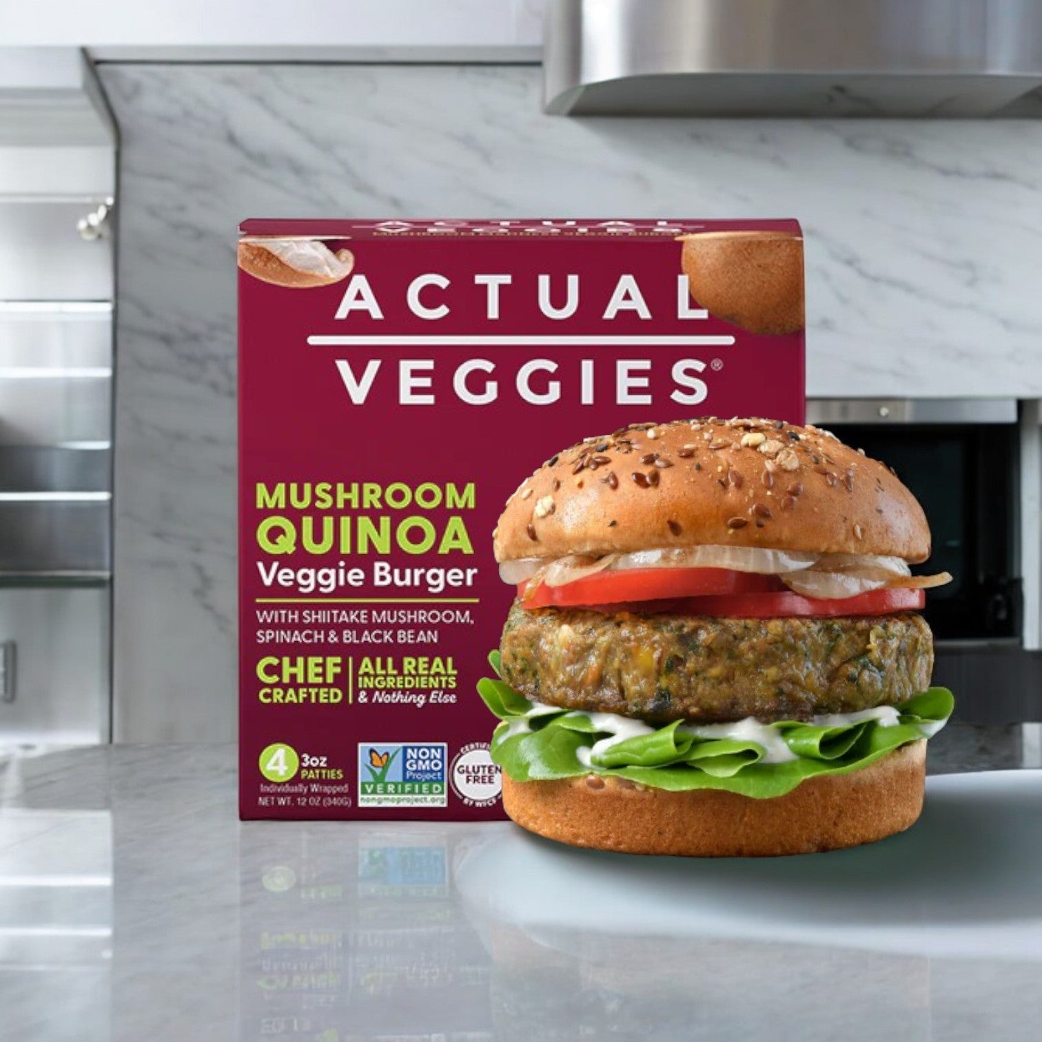 The Actual Veggies 4 Pack Bundle, featuring a variety of veggie burgers, is elegantly displayed with a delectable plant-based burger topped with greens, tomato, and onion on a sesame seed bun, all set on a marble countertop in a cozy kitchen setting.