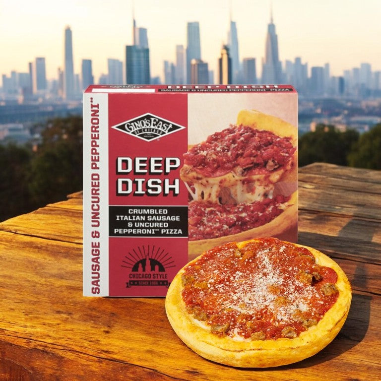 An authentic Windy City flavor, Easy Lunches' Deep Dish Combo Pack with 3 deep dish pizzas sits on a wooden surface, the city skyline providing a perfect backdrop.