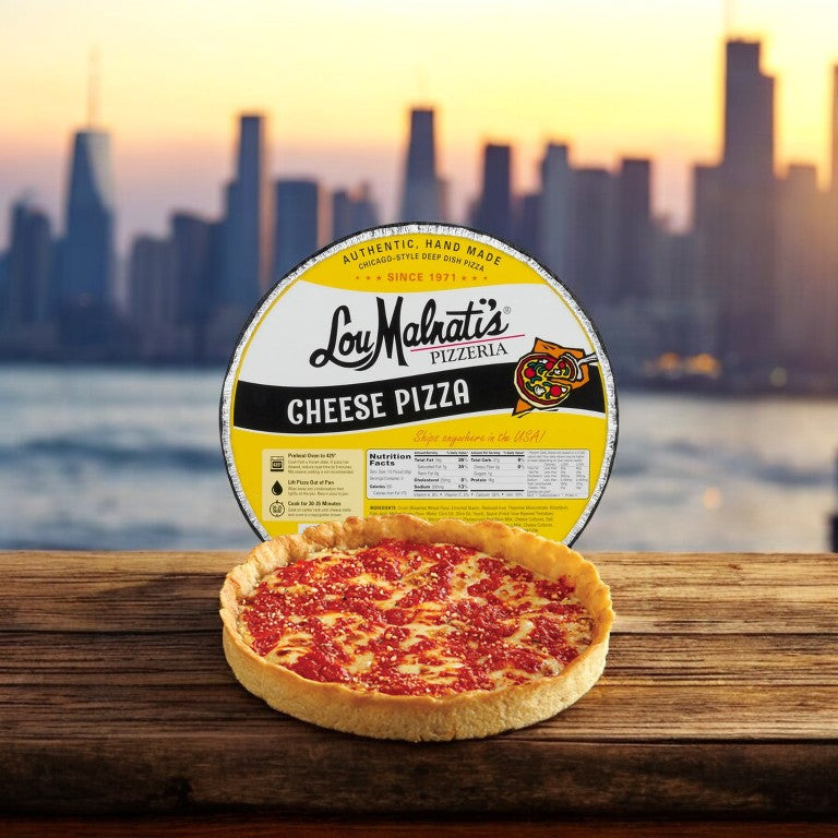 Easy Lunches' Deep Dish Combo Pack—a trio of authentic Chicago deep dish pizzas—graces a wooden table against the stunning city skyline backdrop.