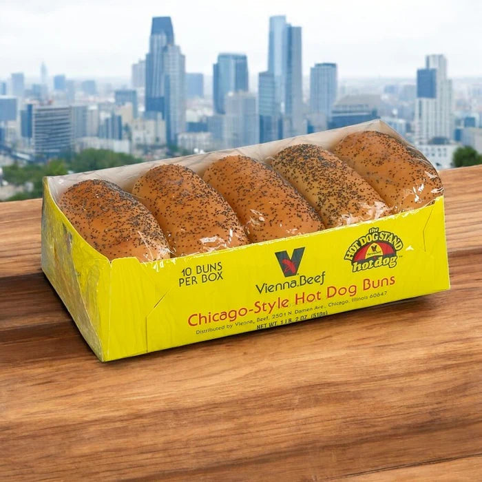A Vienna Hot Dog Kit! Chicago Style! from Vienna Beef, featuring 32 hot dogs with condiments and buns, sits on a wooden surface with a city skyline in the background—perfect for making classic Chicago-style hot dogs.