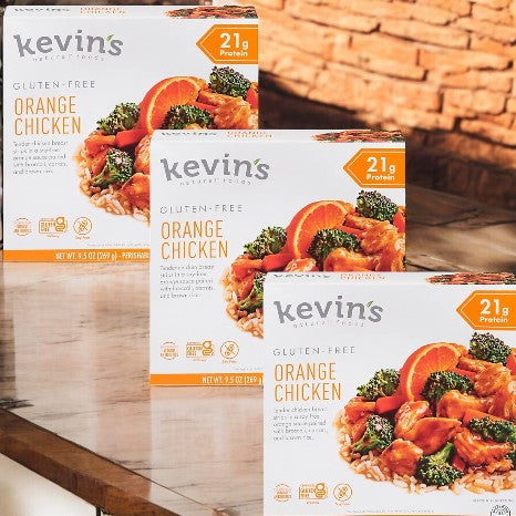 Three boxes of Kevin's Natural Foods Orange Chicken (3 Count) by Kevin's, each showing the dish with rice, broccoli, and orange slices on the packaging, and labeled with 21g protein per serving.