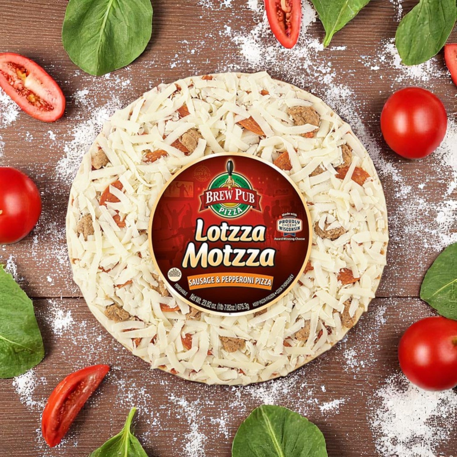 A 23.82 oz Brew Pub Pizza – Sausage & Pepperoni from Bernatello's Pizza, topped with Wisconsin mozzarella cheese, rests on a floured surface amid fresh tomatoes and spinach leaves.