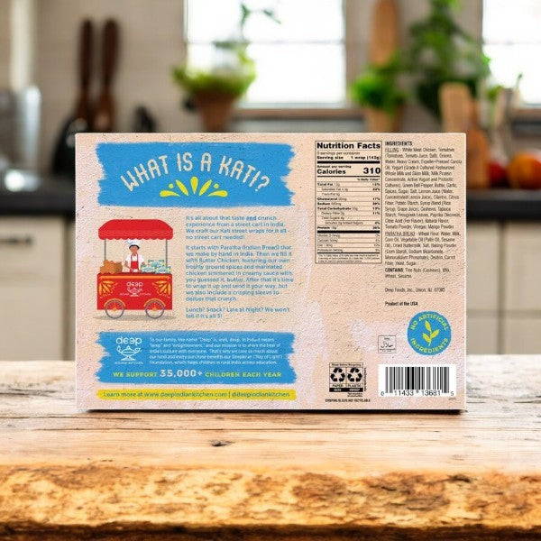 The back of a Deep Indian Kitchen Kati Street Wrap, Butter Chicken (6 count, 3 cases) box displays info about "Kati," nutrition facts, and a cartoon food cart—bringing the flavors of Indian street food to your kitchen.