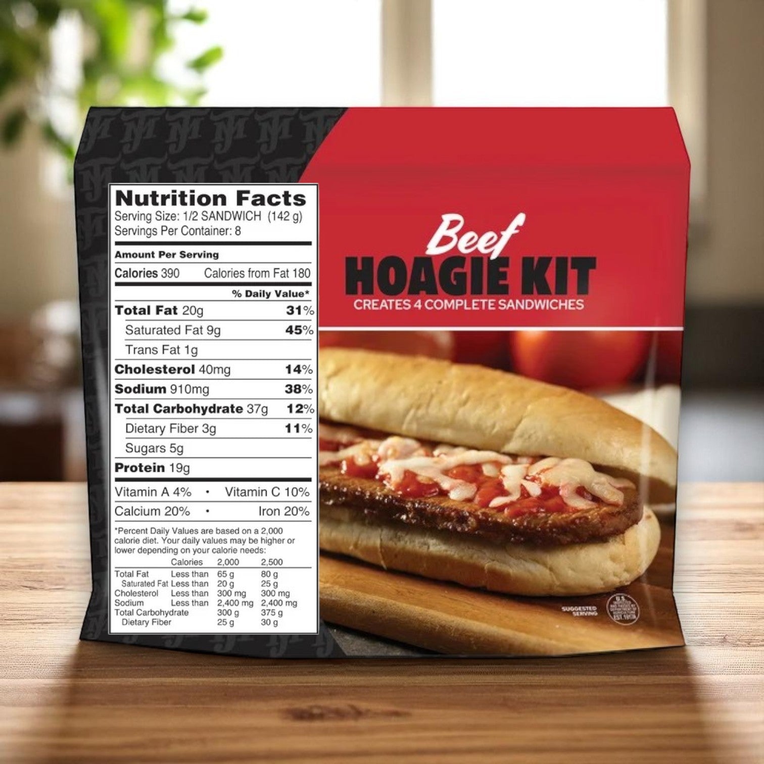 A J.T.M. Beef Hoagie Kit – 3 Packs (2 lbs Each) sits on a wooden surface, showing nutrition facts and a Philly-style sandwich filled with fully cooked seasoned beef, cheese, and sauce. Makes 12 complete sandwiches.