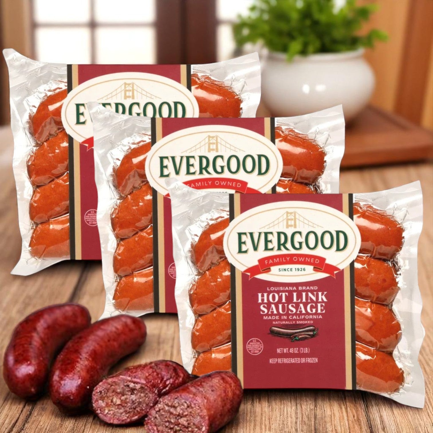 Three packs of Easy Lunches Evergood Louisiana Brand Hot Link Sausage, 36 links (9 lbs), are shown with cooked sausages on a wooden surface, emphasizing their naturally smoked flavor and spicy kick.