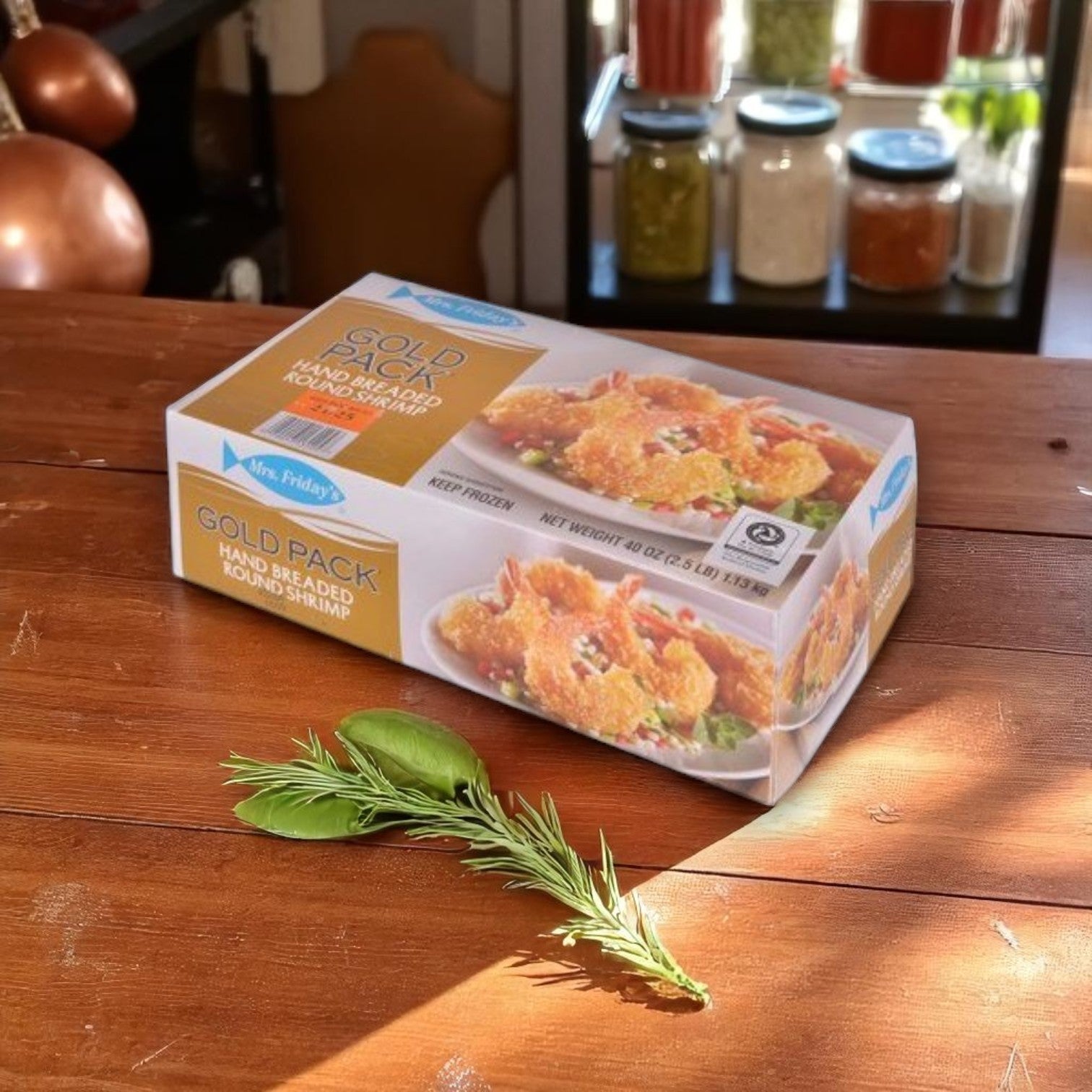 Mrs. Friday’s® Breaded Round Shrimp – 21/25 Count (6 Case of 2.5 lb. Bags) on a wooden table with rosemary and sage—ideal as premium shrimp seafood appetizers from Mrs. Friday's.