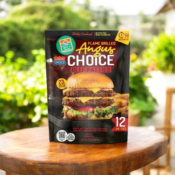 A box of Don Lee Farms Flame Grilled Angus Choice Beef Patties, Frozen, 1/4 lb., 12 ct sits on a wooden table outdoors with a blurred green background—highlighting premium quality at competitive prices.