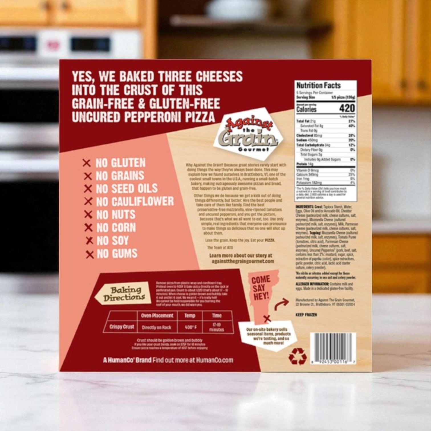 The back of an Easy Lunches Gluten-Free Pepperoni Pizza Assortment box (with DiGiorno, Against The Grain & Udi’s pizzas) shows ingredients, nutrition facts, baking instructions, and dietary info on a kitchen counter.