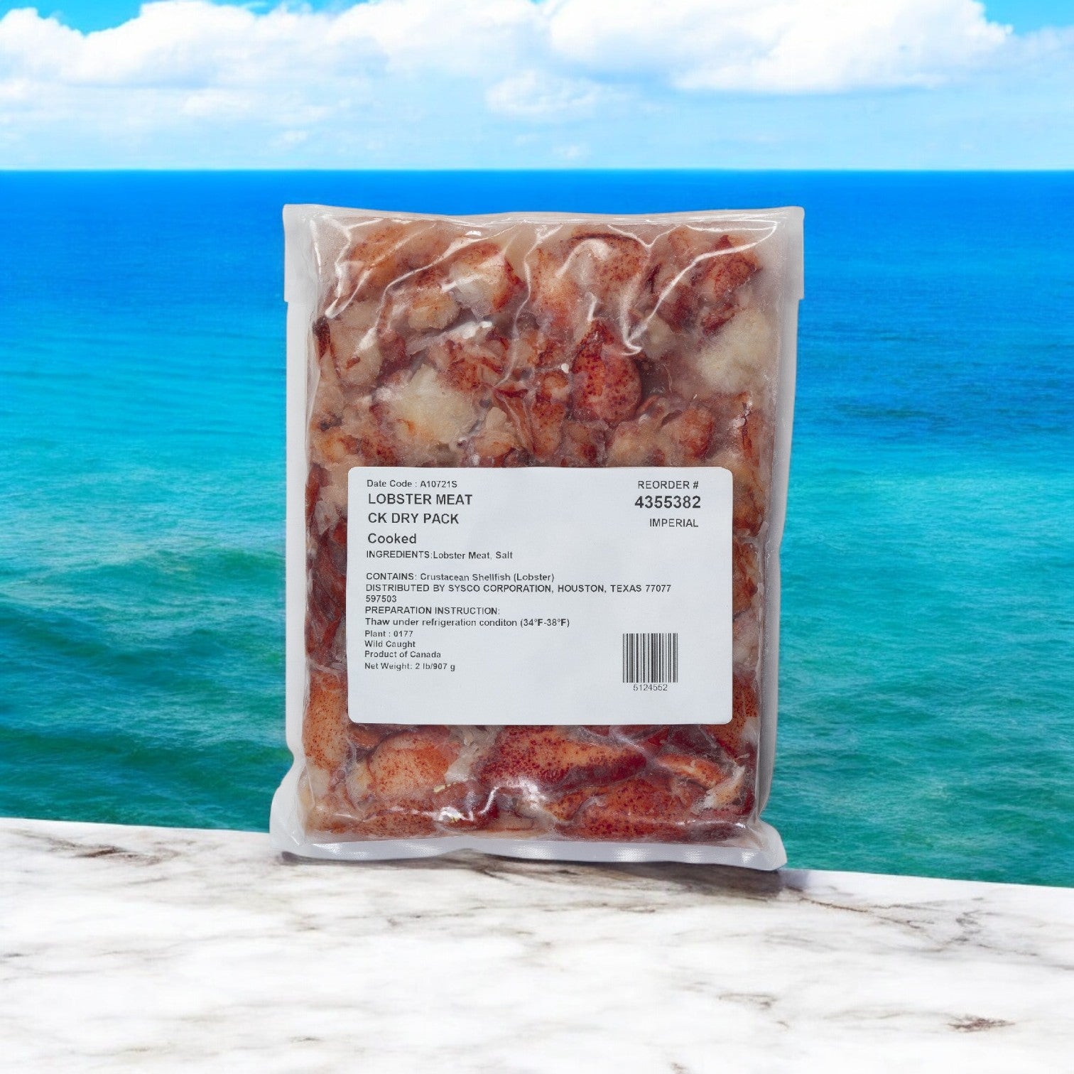 A 12-lb case (6 packs, 2 lbs each) of Easy Lunches Maine Lobster Meat Claw Knuckle is displayed on marble with an ocean view.