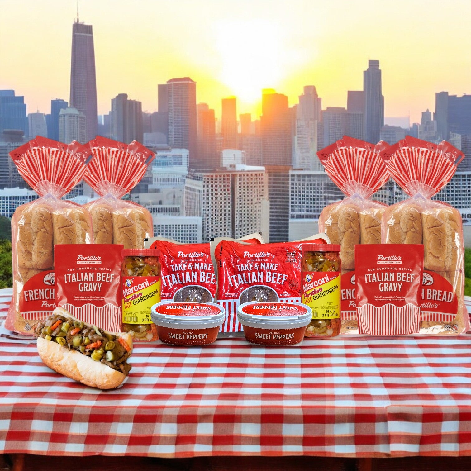 A Portillo's 32 Sandwich Italian Beef Sandwich Combo-Perfect For Parties! adorns a table with beef, gravy, sweet peppers, and bread against a sunset-lit Chicago skyline backdrop. Experience true Chicago flavors as day turns to night.
